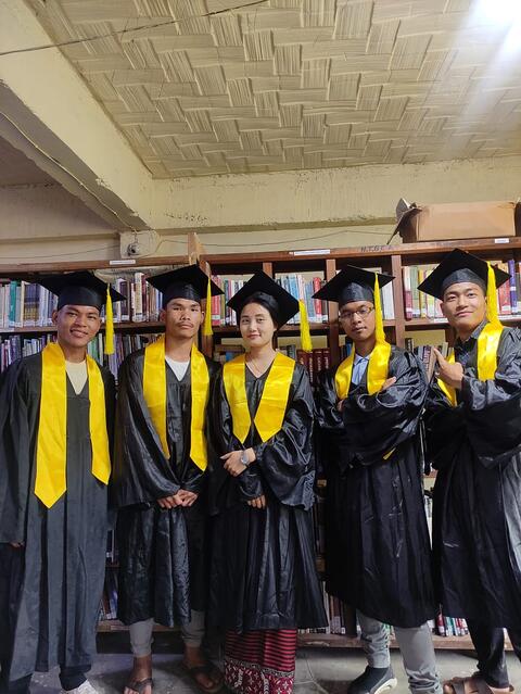 Graduates at library